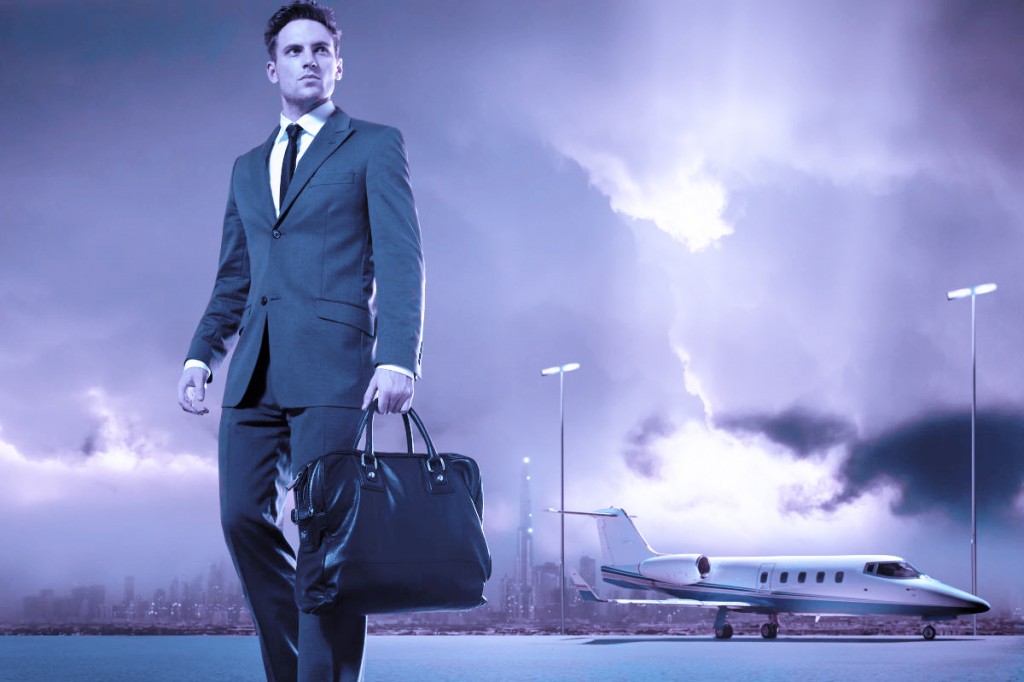 Businessman walking across tarmac