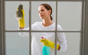 Woman washing window