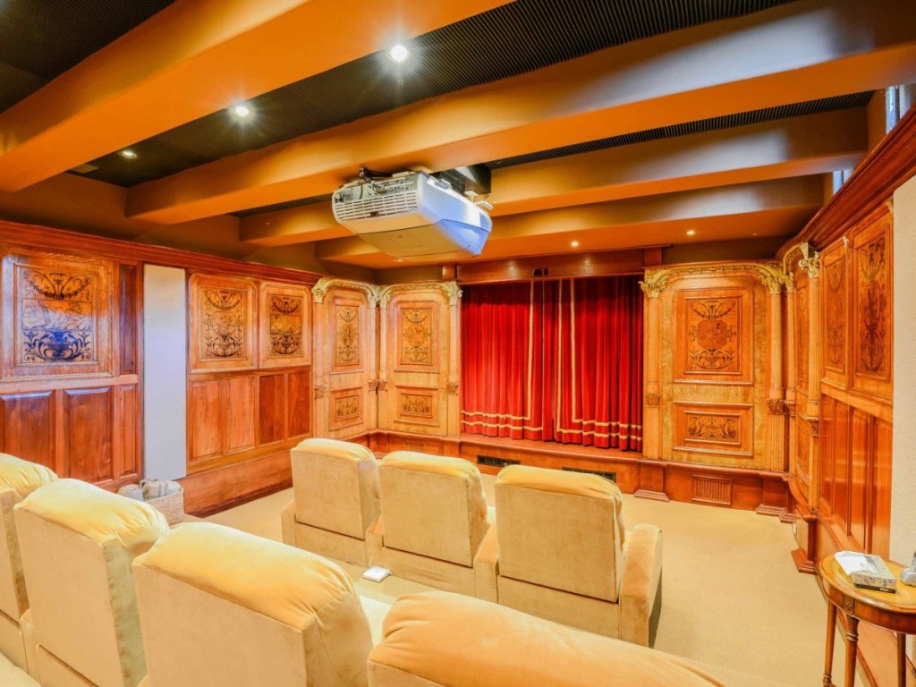 downstairs-is-a-custom-built-movie-theater-with-seating-for-seven-and-a-projector